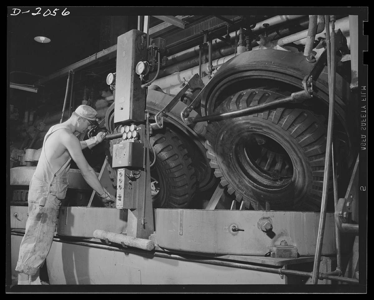 Worker at automatic tire molds, 1940s