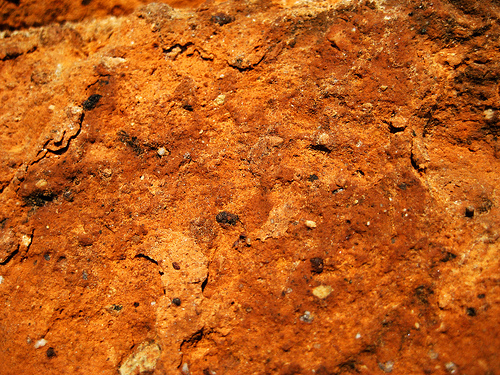 Orange brick surface, extreme close up